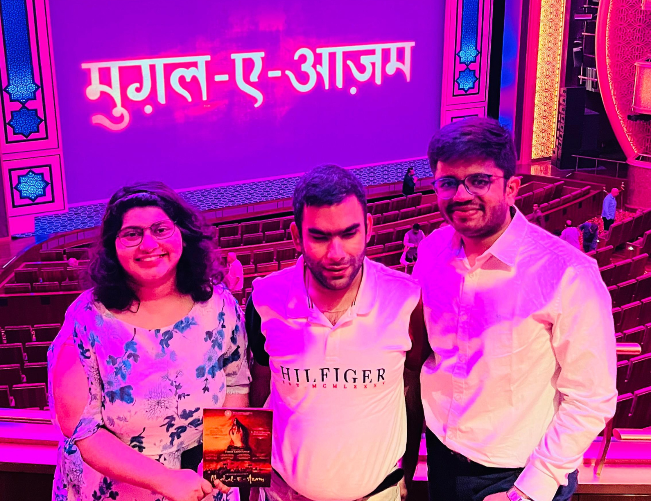 From left to right: Pulakita, Paavan and Anmol at the Grand Theatre with the Mughal-e-Azam title card in the background 