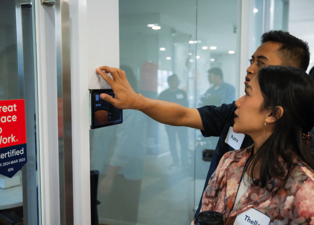 People touching tactile signs installed for easier navigation for the visually impaired.  